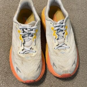 White and Orange Athletic Shoes